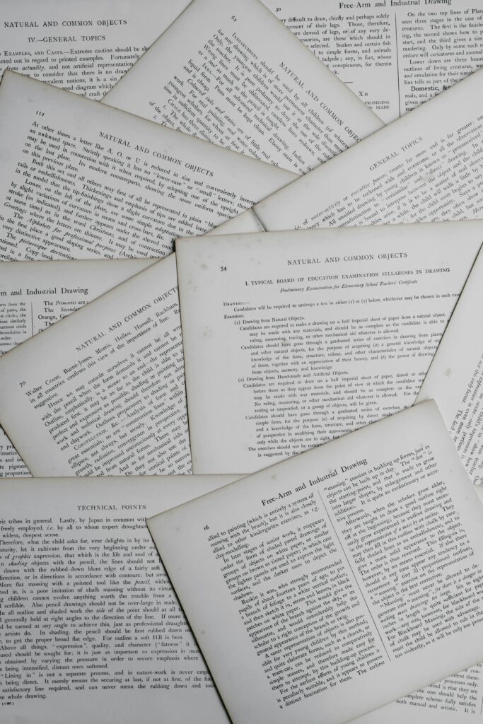 Overlapping pages of printed documents representing the complexity and formatting requirements of certified legal translation.